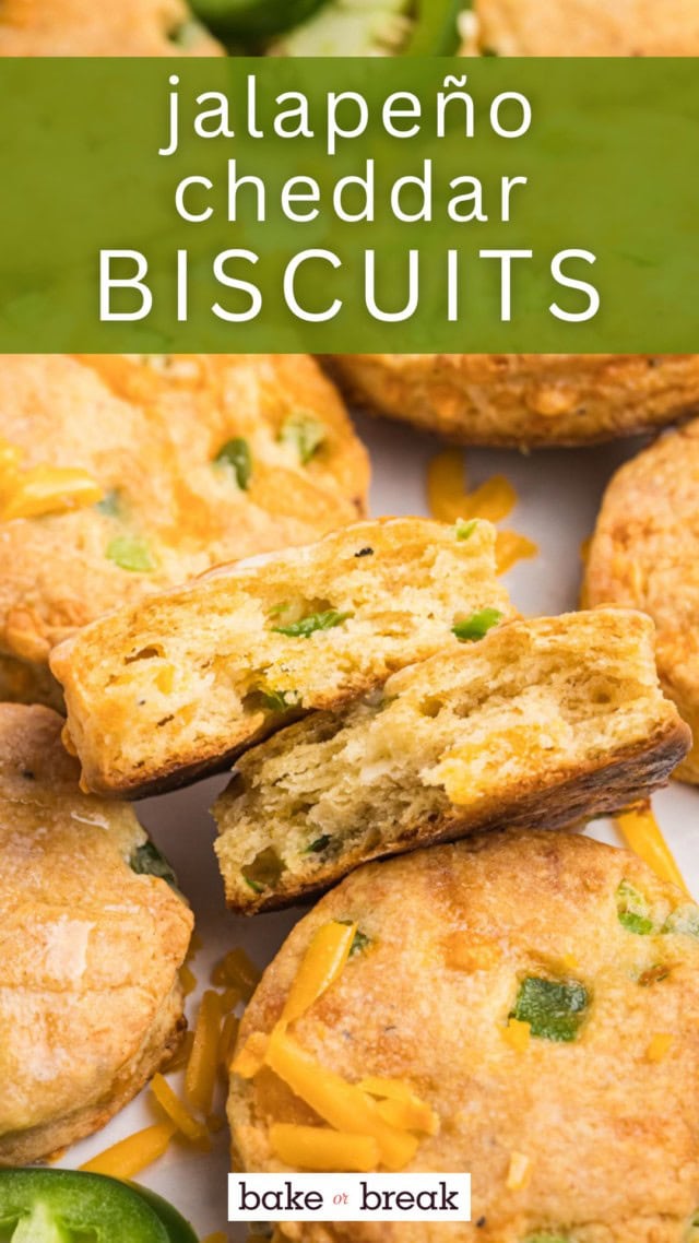 a jalapeño cheddar biscuit cut in half to show the flaky layers, cheese, and peppers inside; text overlay "jalapeño cheddar biscuits bake or break"