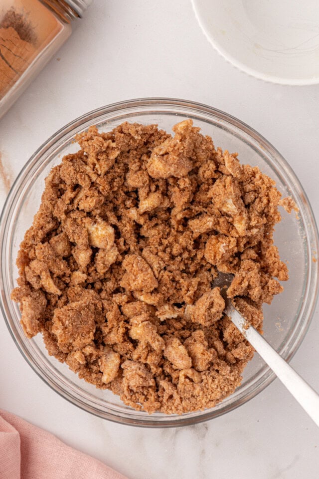 overhead view of cinnamon crumb topping mixture in a mixing bowl