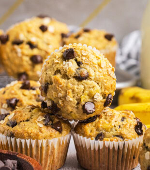 banana oatmeal chocolate chip muffins in a stacked pile