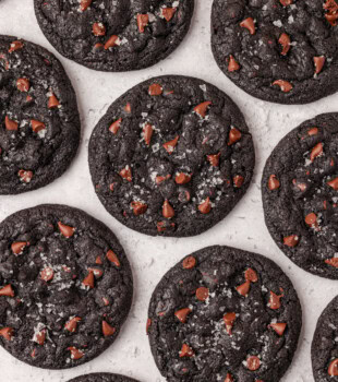 overhead view of black cocoa cookies on a white surface
