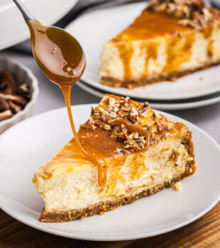 caramel drizzling over a slice of bourbon caramel swirl cheesecake