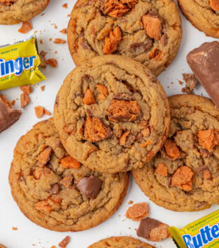 overhead view of Butterfinger cookies scattered on a white surface