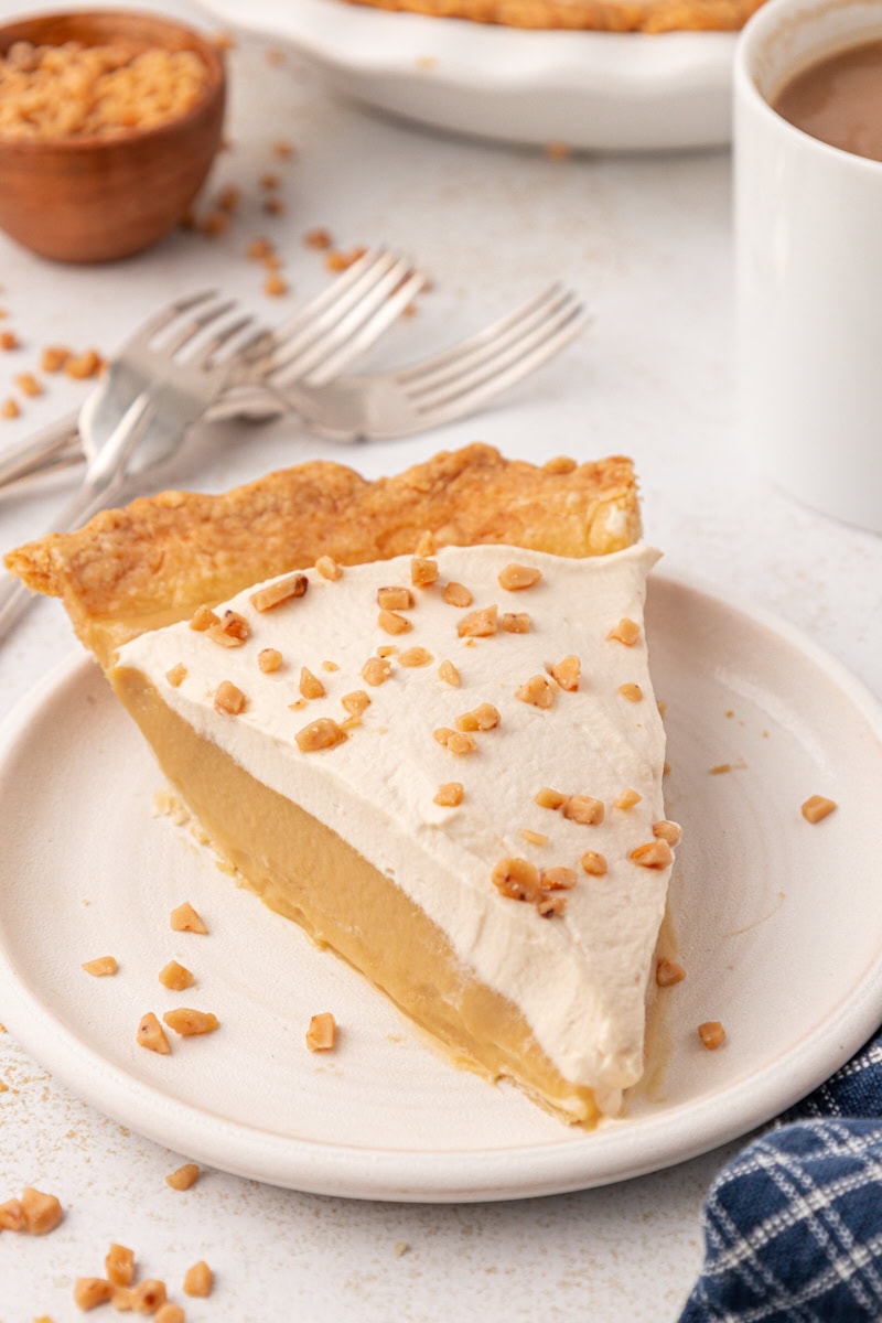 a slice of butterscotch pie on a white plate