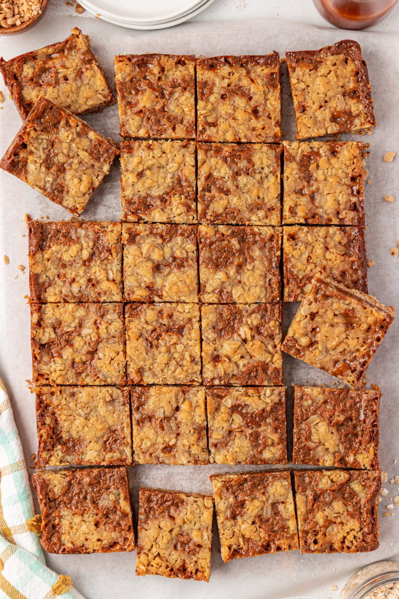 overhead view of sliced dulce de leche bars on  parchment paper