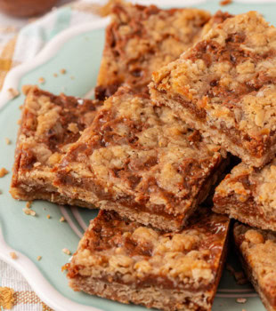 dulce de leche bars served on a light blue plate