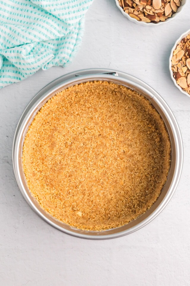 overhead view of a vanilla wafer crust pressed into the bottom of a springform pan