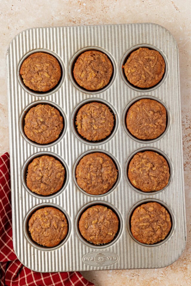 overhead view of freshly baked apple cupcakes in a muffin pan