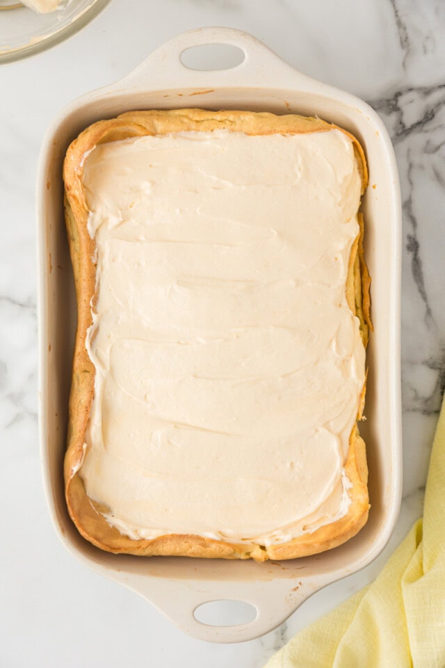 overhead view of filling mixture spread over choux layer for cream puff cake