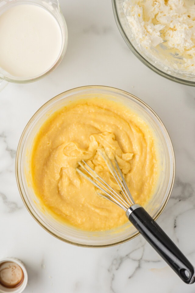overhead view of pudding mix, milk, and vanilla whisked together