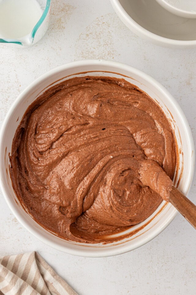 overhead view of German chocolate cake batter in a white mixing bowl