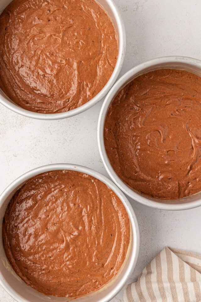 overhead view of German chocolate cake divided into three round cake pans