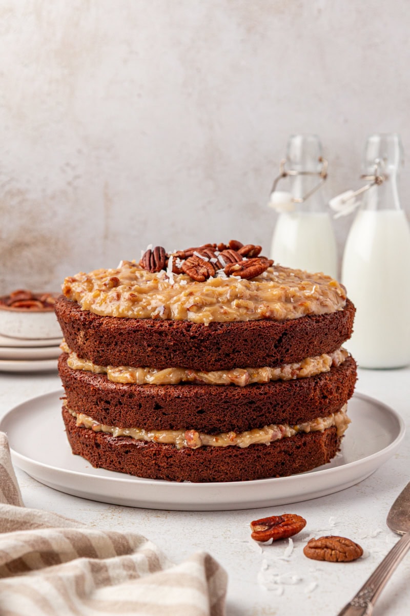 German chocolate cake on a white cake plate
