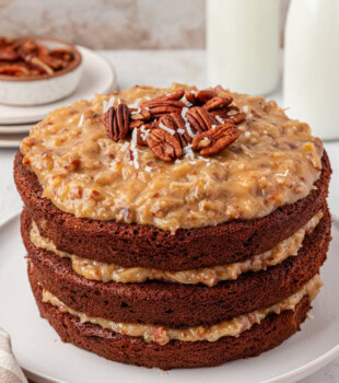 German chocolate cake on a white cake plate