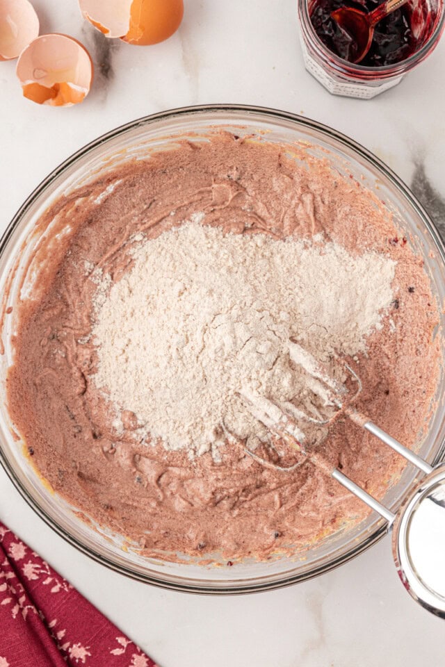 overhead view of dry ingredients added wet ingredients for Kentucky jam cake batter