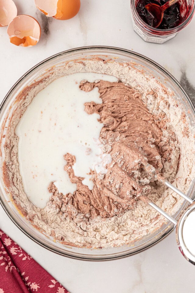 overhead view of buttermilk added to cake batter