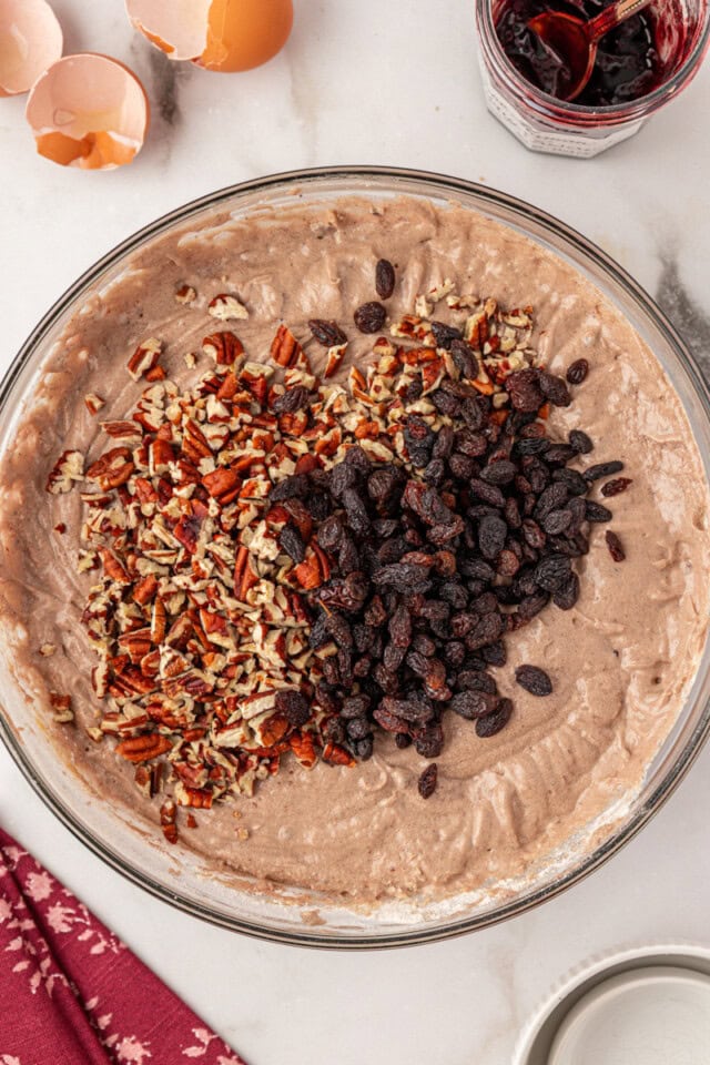 overhead view of chopped nuts and raisins added to Kentucky jam cake batter
