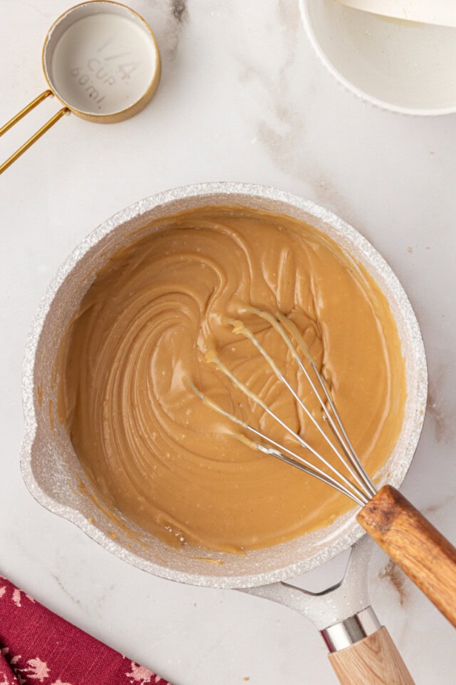 overhead view of brown sugar caramel frosting in a saucepan