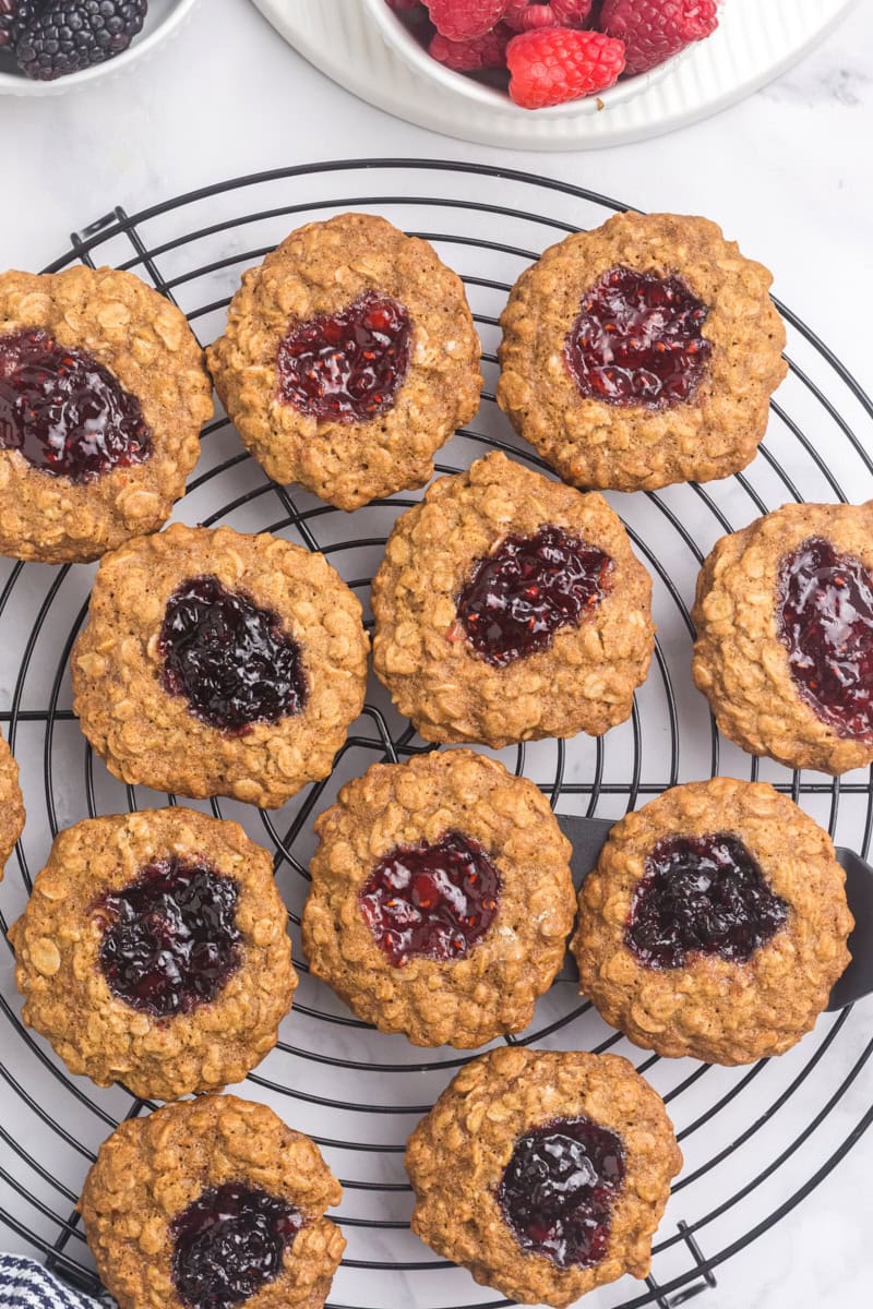 overhead view of oatmeal thumbprint cookies on a cooling rack