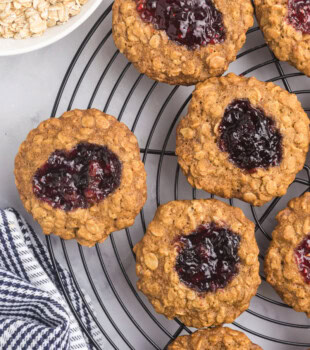 overhead view of oatmeal thumbprint cookies cooling on a wire rack