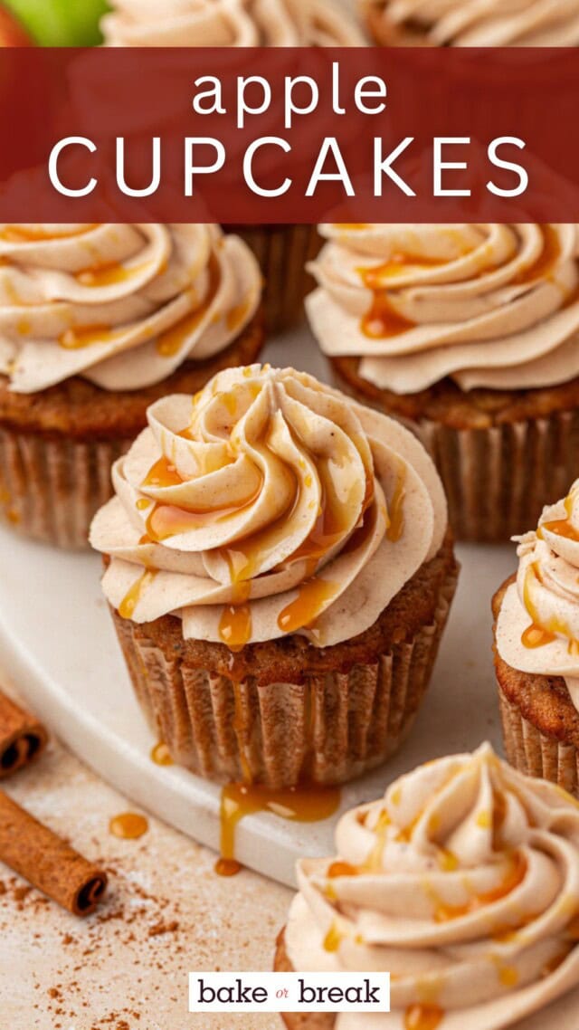 an apple cupcake topped with spiced. cream cheese frosting and a drizzle of caramel, with more cupcakes in the background; text overlay "apple cupcakes bake or break"