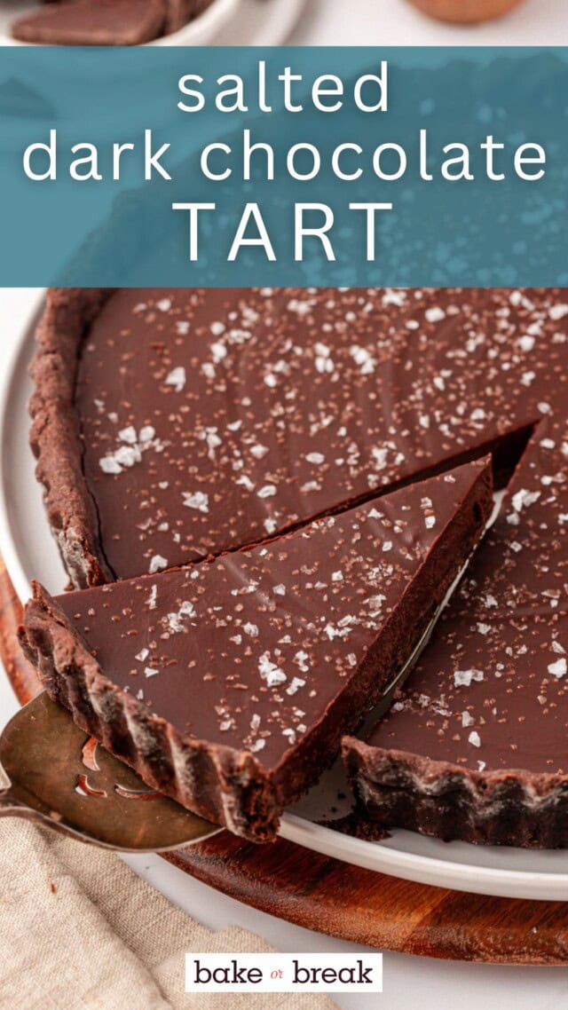 a slice of salted dark chocolate tart on a pie server lifting away from the remaining tart; text overlay "salted dark chocolate tart bake or break"