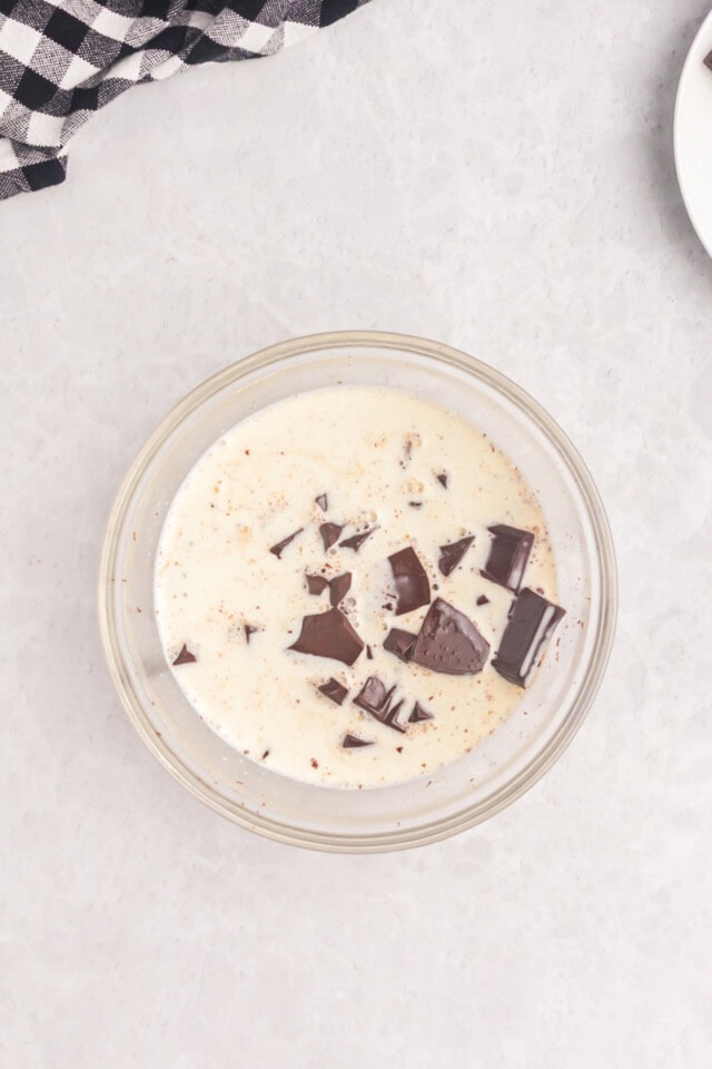 overhead view of hot cream poured over chopped chocolate