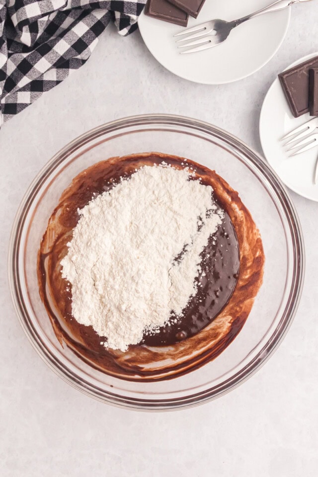 overhead view of flour added to brownie mixture