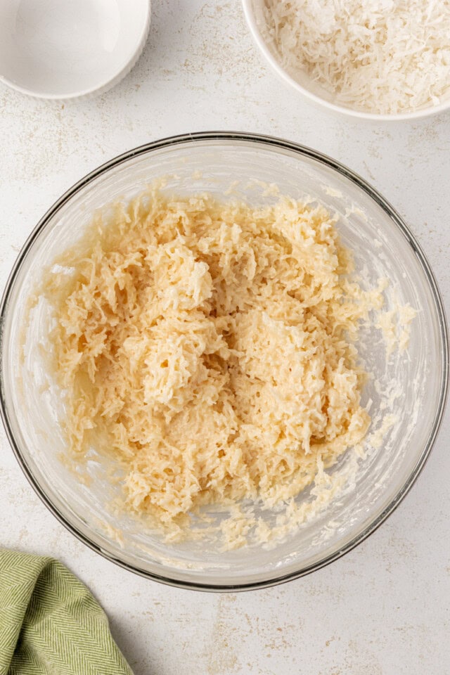 coconut snowballs mixture in a glass mixing bowl