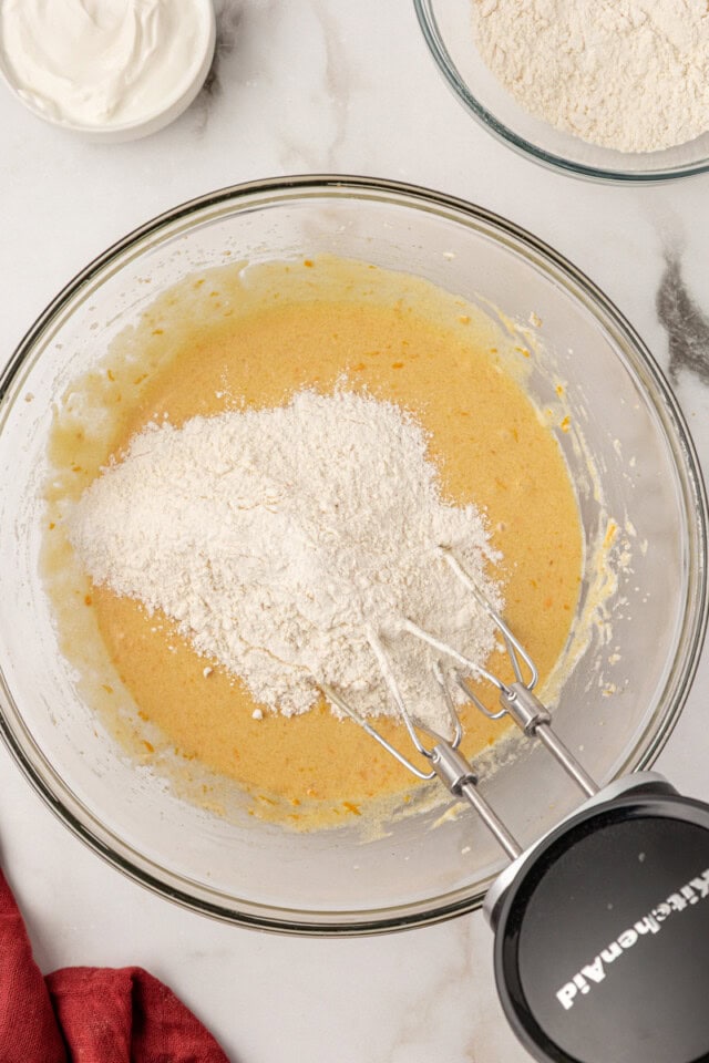 overhead view of dry ingredients added to cake batter