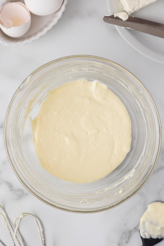 overhead view of mixed cream cheese and egg in a mixing bowl