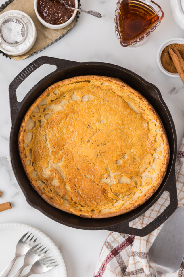 overhead view of freshly baked Dutch baby pancake in a cast iron skillet