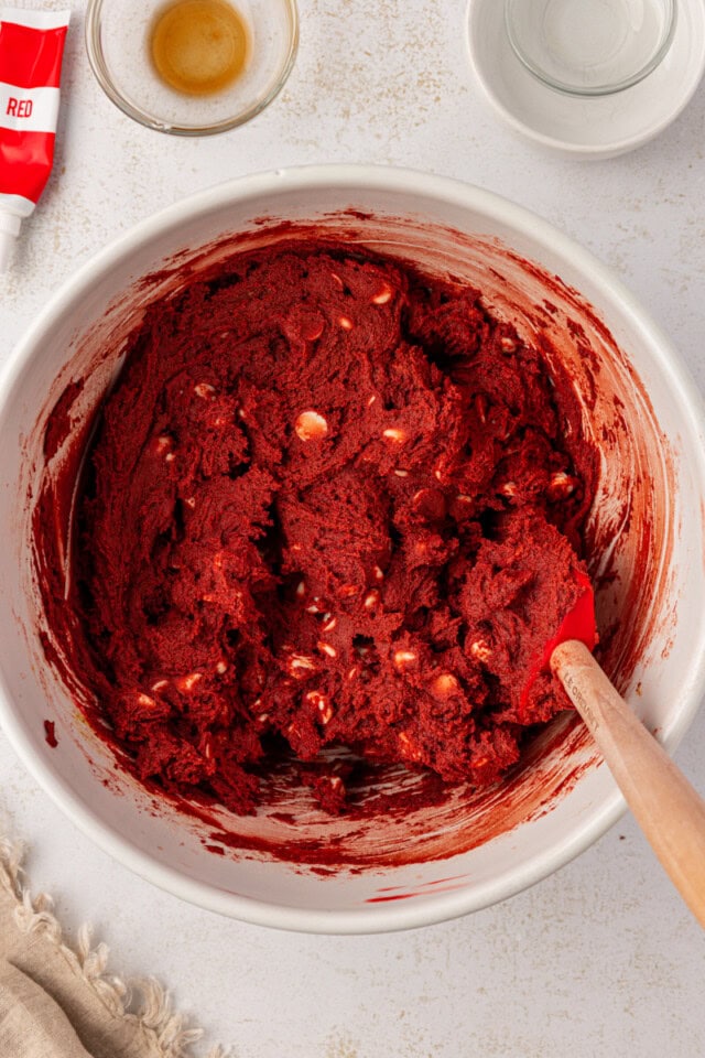 red velvet cookie batter in a white mixing bowl
