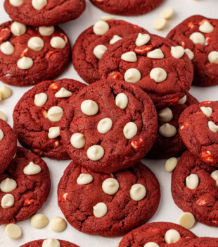 red velvet cookies scattered on a white surface