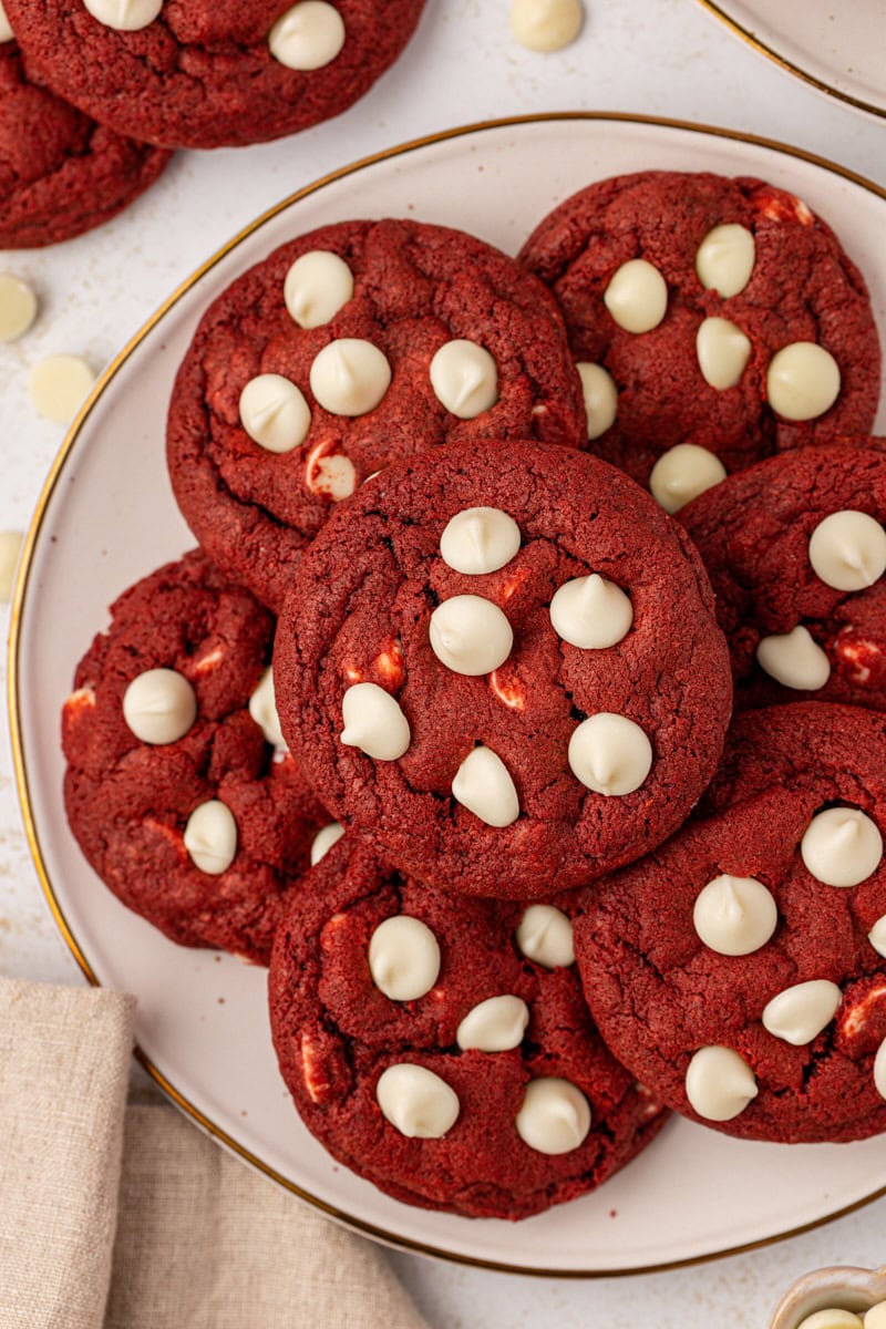 overhead view of red velvet cookies on a white plate