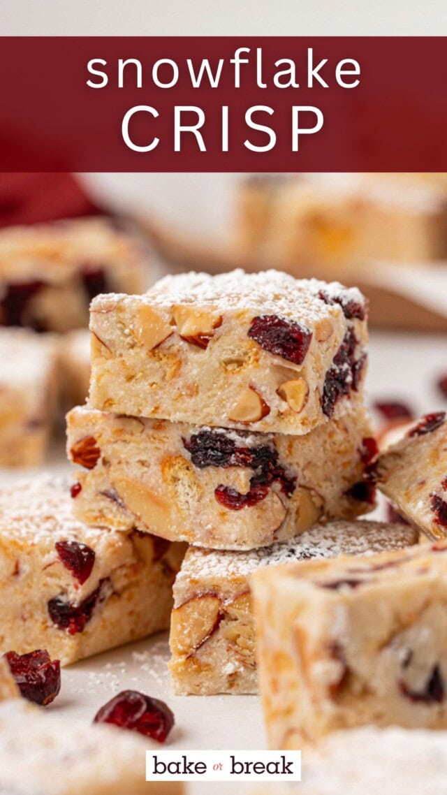 stacked pieces of snowflake crisp filled with nuts, crackers, and cranberries and topped with confectioners' sugar; text overlay "snowflake crisp bake or break"