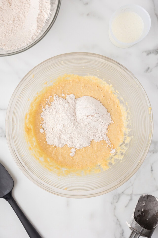 overhead view of dry ingredients added to cake batter