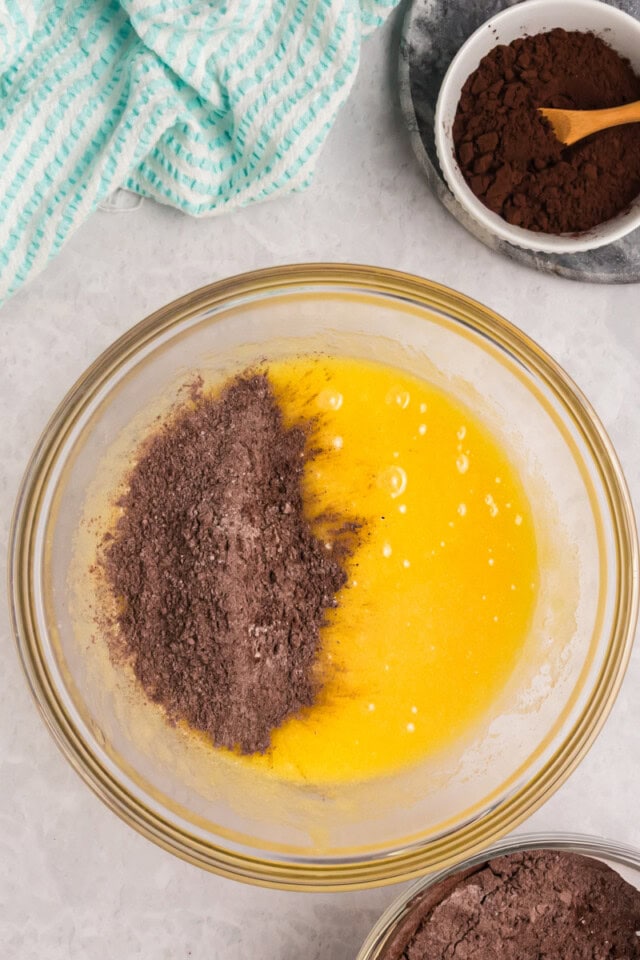 overhead view of dry ingredients added to wet ingredients for brownies