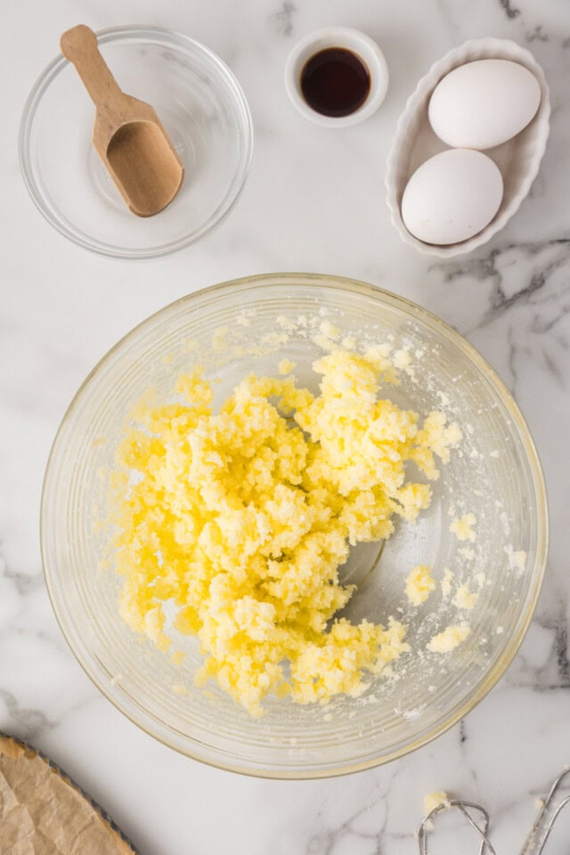 overhead view of creamed butter and sugar in a mixing bowl