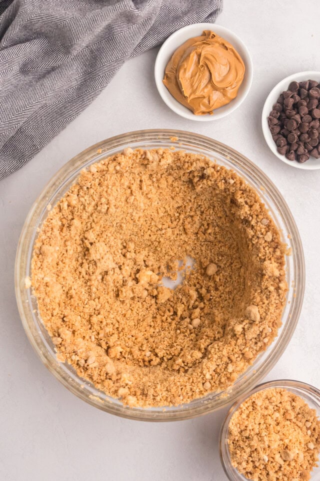 overhead view of partially mixed peanut butter snack cake mixture with a portion removed to use for topping