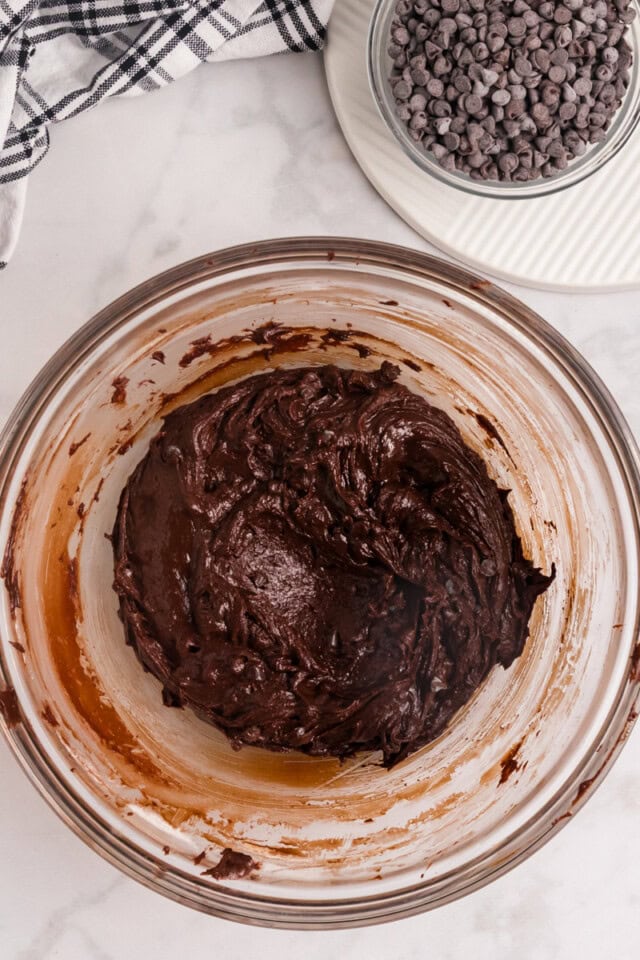 overhead view of salted chocolate truffle cookie dough in a glass mixing bowl