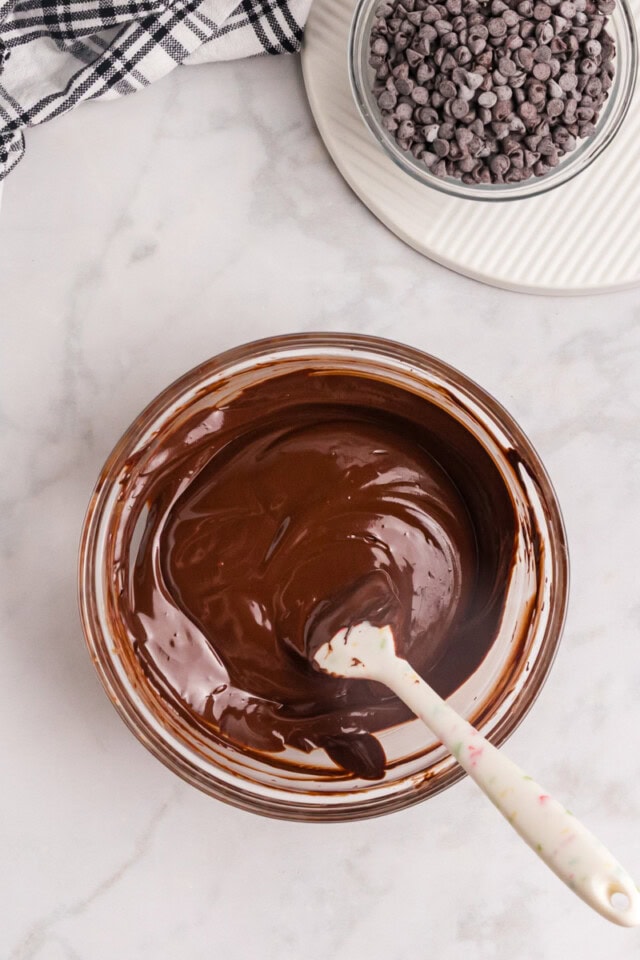 overhead view of melted chocolate and butter in a glass bowl