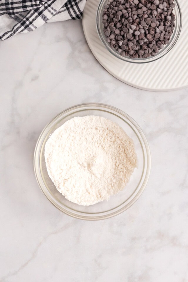 overhead view of flour, baking powder, and salt combined in a small mixing bowl