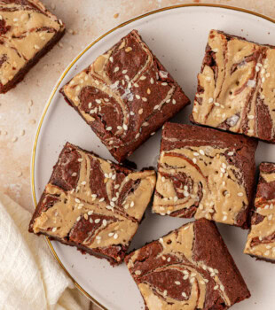 overhead view of tahini brownies on a white plate