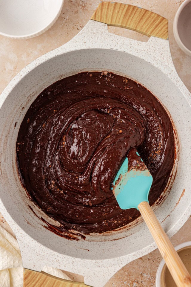 overhead view of tahini brownie batter in a saucepan