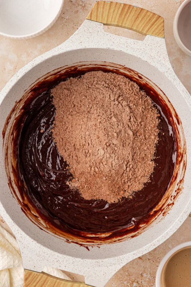 overhead view of dry ingredients added to brownie mixture