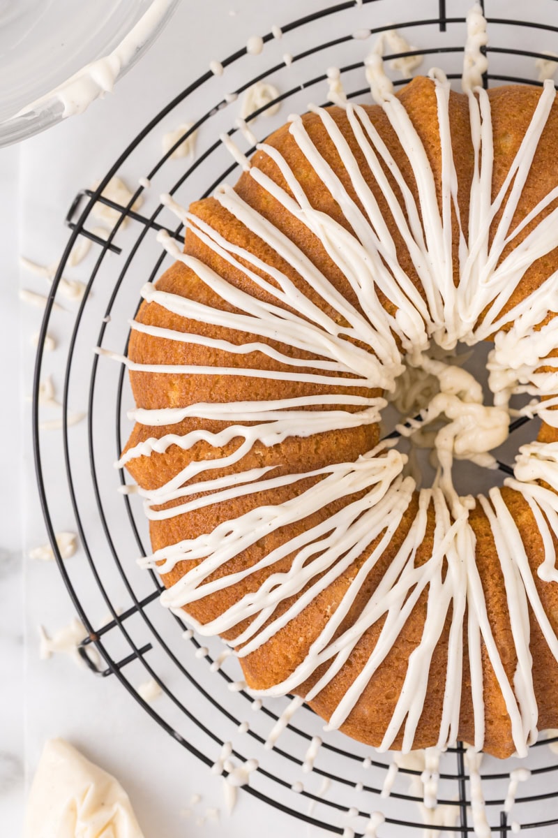 overhead view of vanilla Bundt cake finished with a smooth vanilla glaze