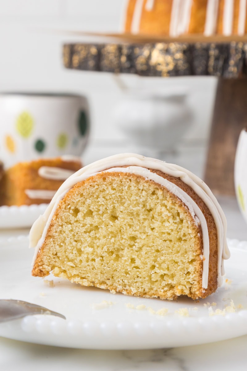 a slice of vanilla Bundt cake on a white plate