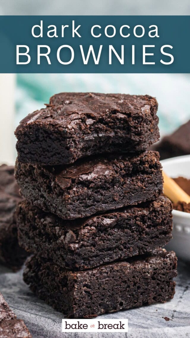 stack of four dark cocoa brownies with a bite missing from the top brownie; text overlay "dark cocoa brownies bake or break"