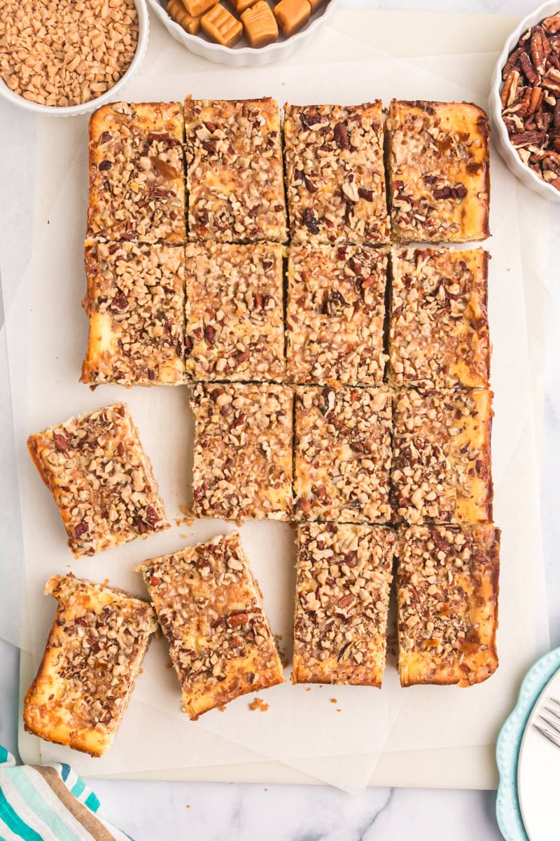 overhead view of caramel cheesecake bars cut into bars