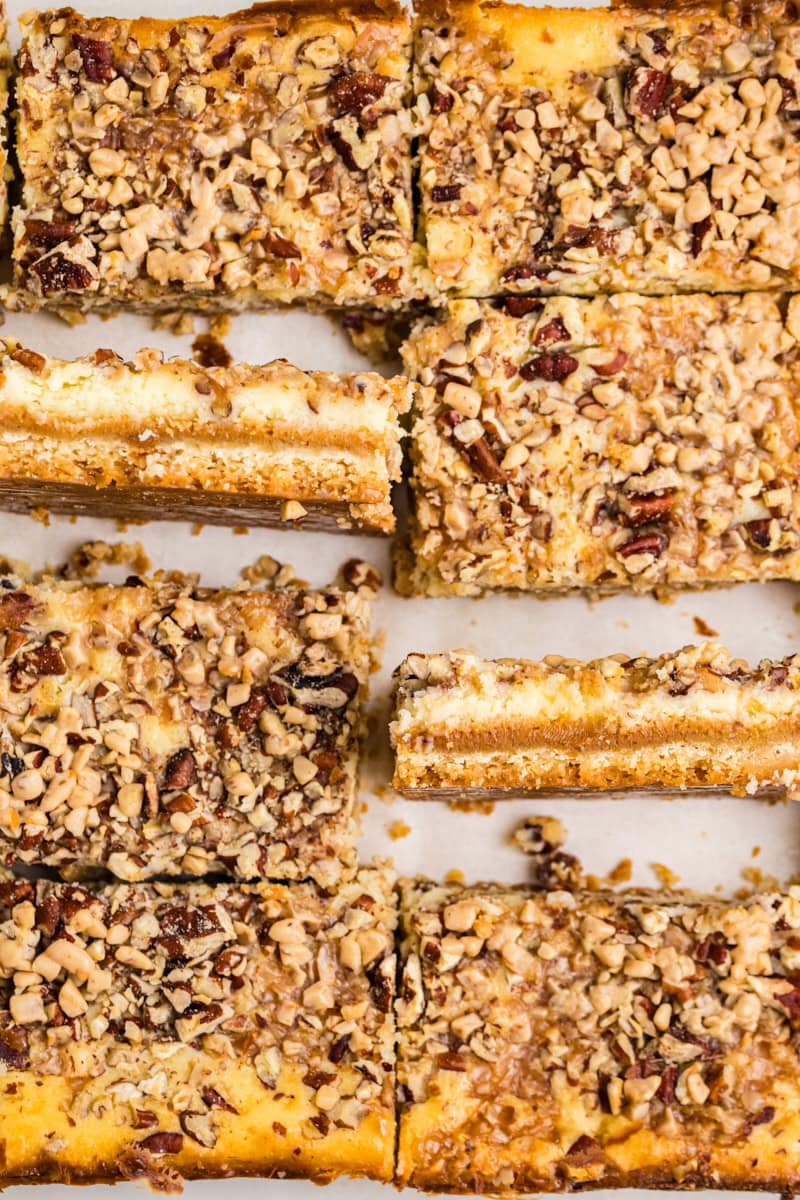 caramel cheesecake bars with clean slices showing layered texture